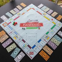 A monopoly board game centered around the pandemic. 