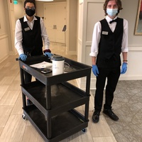 Room service with masks and gloves.