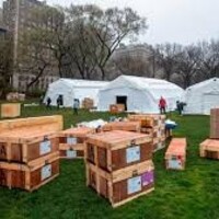 A field hospital and crates of supplies. 