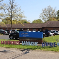 A "Heroes Work Here" yard sign. 