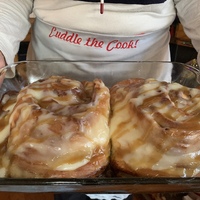 Glass pan with cinnamon rolls.