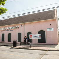 Skateboarders in front of Castellon Pharmacy in New Orleans. 