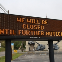 A digital sign reading "We will be closed until further notice".