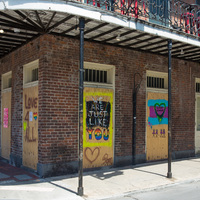 Graffiti on a boarded up building.