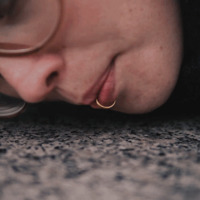 A face next to a trash can.