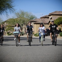 five people riding bikes. 