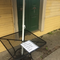 a sign on a metal table saying "sorry the mayor says you can't sit here"