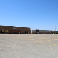 Photo of an empty store parking lot.