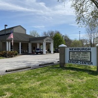 A sign outside a senior center reading "One Good Thing About the World, There Will Always be More Springs!".