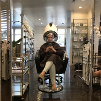 Photo of a woman in a hair salon. 