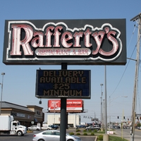 A restaurant sign reading "Delivery Available $25 minimum".