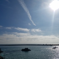 A photo of a body of water at the beach. 