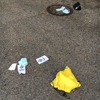 Emergency drinking water and other debris littered on the ground. 