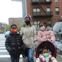 A family with masks on. 