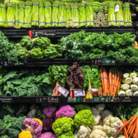 A fully stocked produce section at a grocery store. 