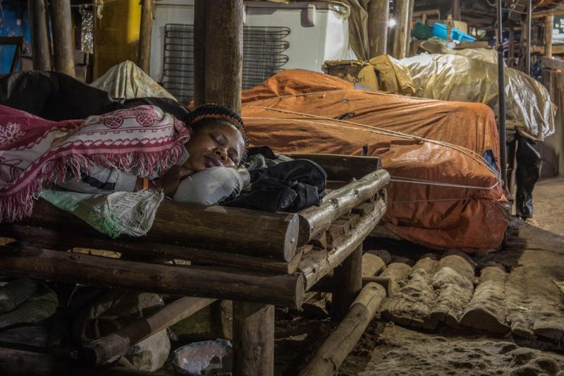 Woman sleeping in a shop. 