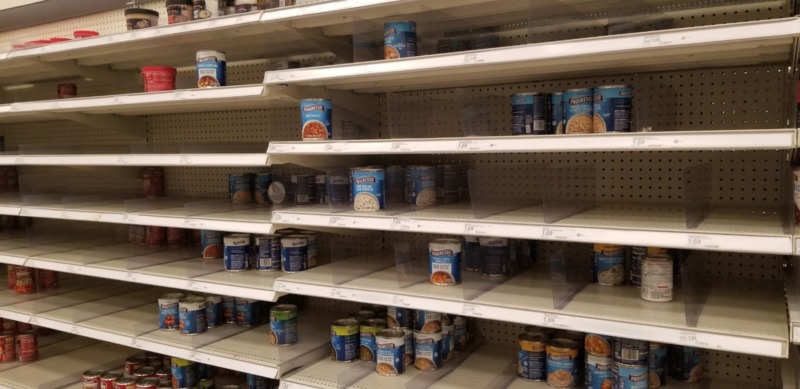 Empty grocery store shelving.