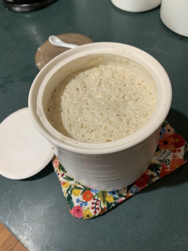 sourdough starter in a white jar